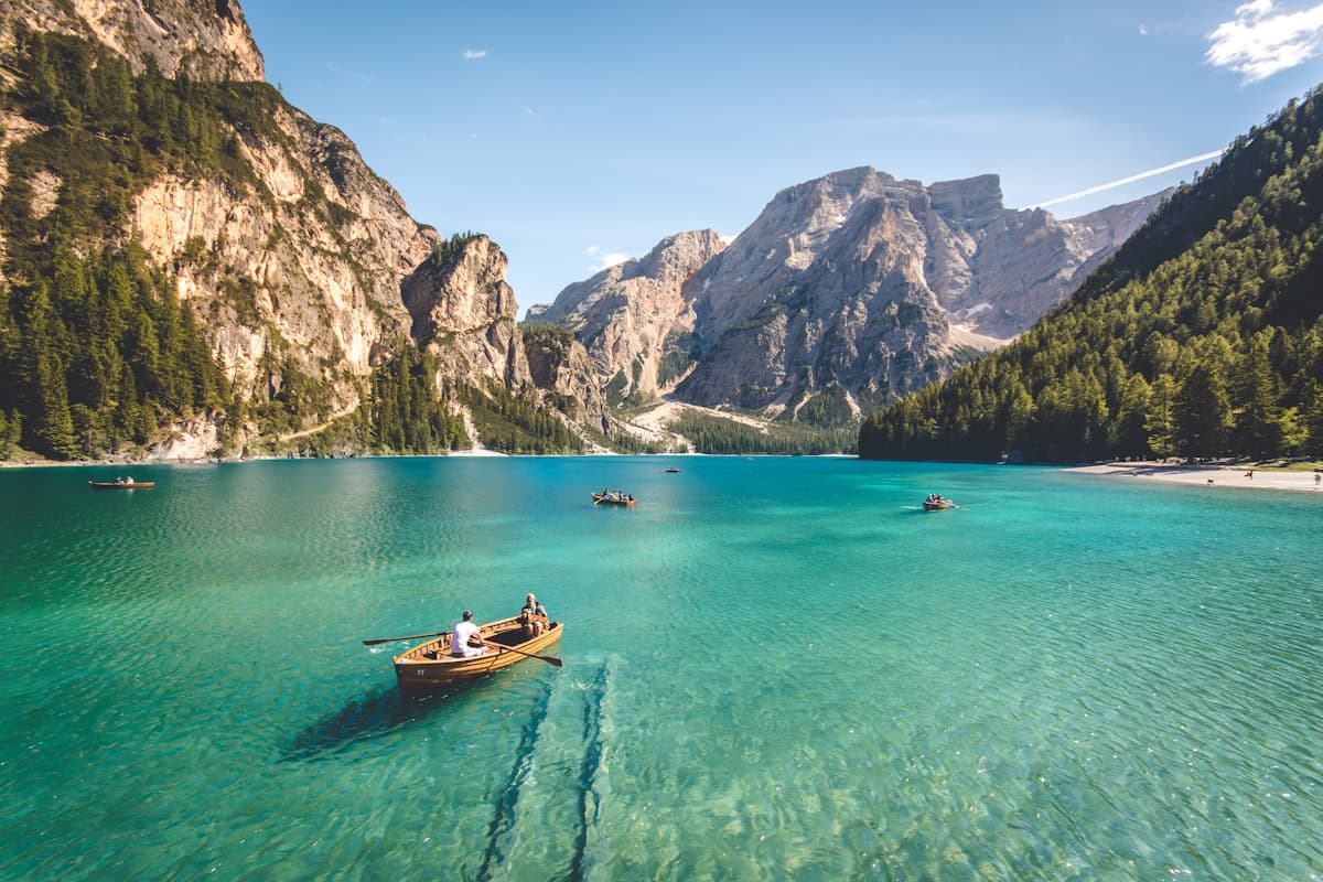 A peaceful mountain landscape reflected in a still lake at golden hour